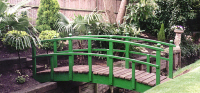 Bridge 12 - 10ft (3.04m) Japanese style bridge (with ball finials) painted green with boards stained Dark Oak. All components normally kept in stock.
				  £860