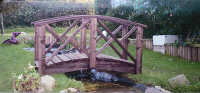 Bridge 9 - 5ft (1.52m) curved bridge (Chinese style) - stained Dark Oak- our shortest stock bridge. Finials extra if required. We keep beams from 3ft (91cms).
 £365